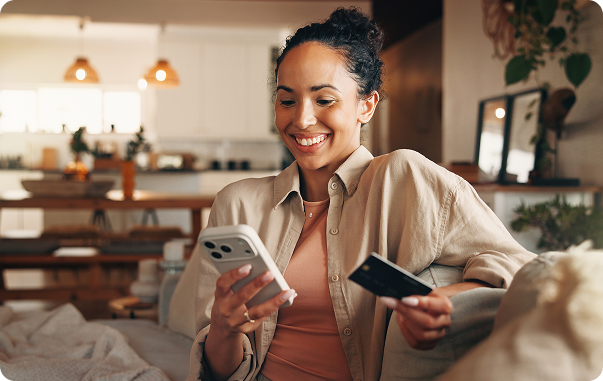 Image shows a woman working on her phone