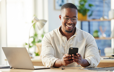 Image of a man smiling at this phone Image of a man smiling at this phone