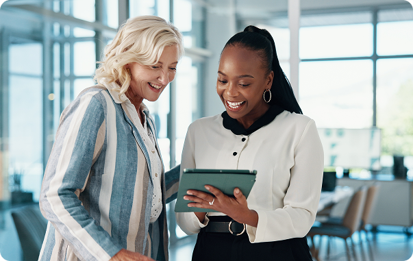 image of two coworkers looking at tablet