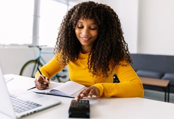 smiling-african-american-woman-working-with-comput-2023-11-27-05-25-32-utc